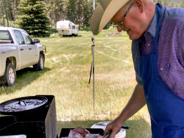 Catering staff cooking in Western attire for old west catering event