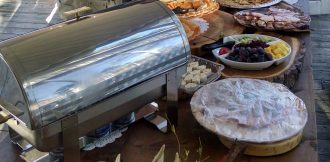 Catering food presentation with chafer, vegetable, fruit, cheese and meat trays and etcetera